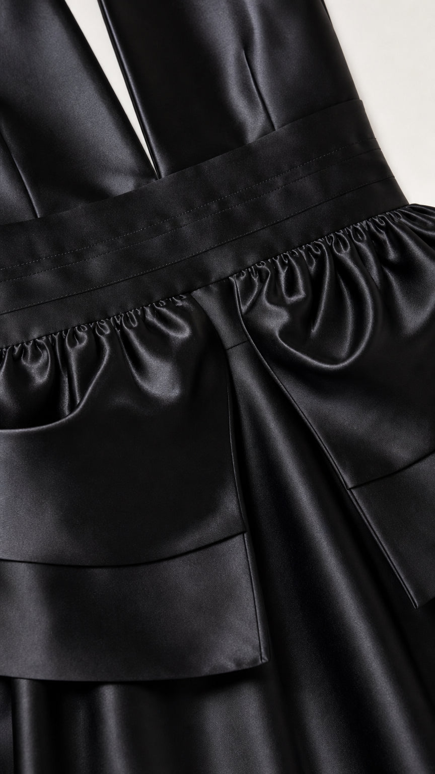 Close-up detail of the waist bow and satin texture