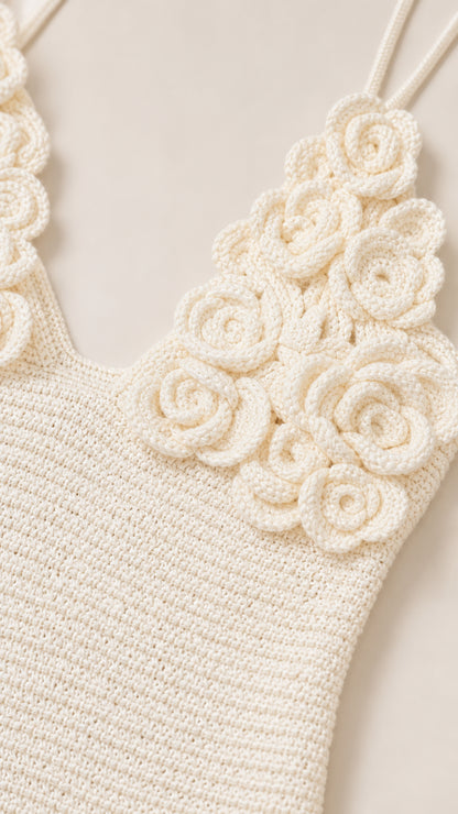 Close-up of the 3D crochet floral appliqués and neckline