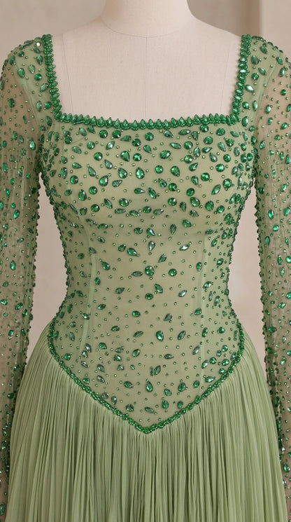 Close-up detail of green beaded square neckline and basque waist embellishments