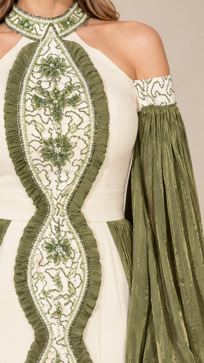 Close-up detail of central floral beadwork embroidery and halter neckline
