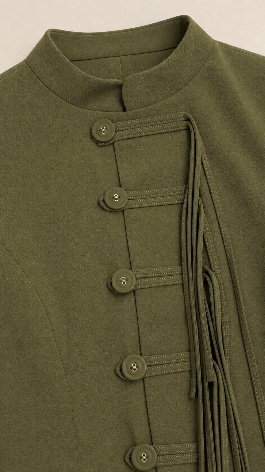 Close-up detail of Olive Green stand collar and frog button closures with hanging tassel trim