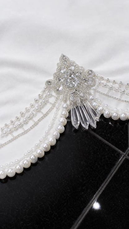 Close-up detail of rhinestone and faux pearl embellished hem