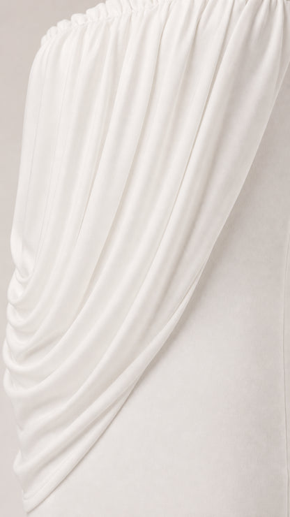 Close up of textured fabric on white draped dress