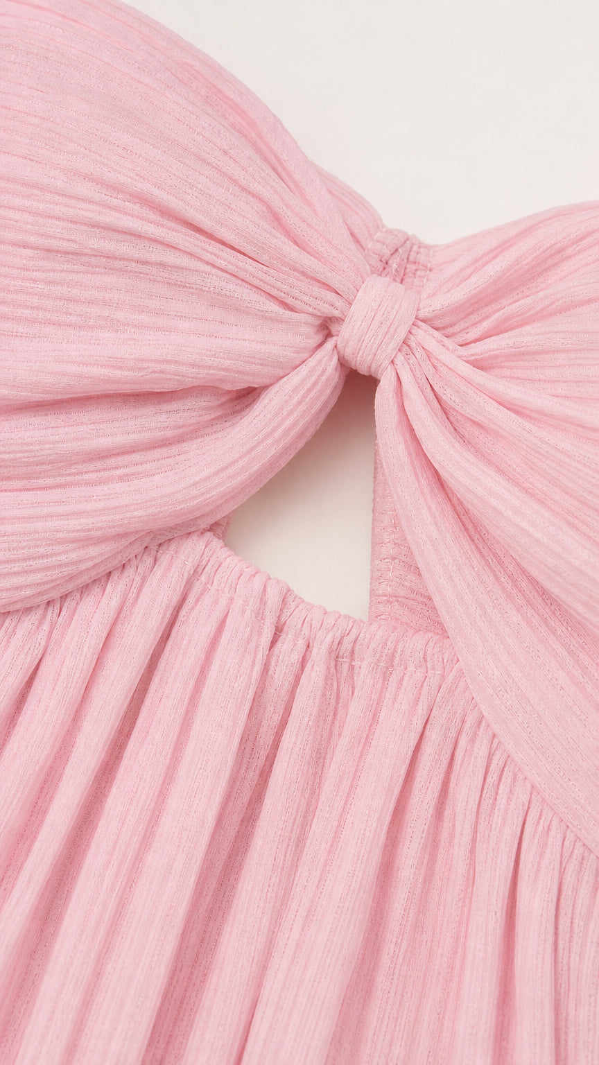 Close-up of the pink textured twist detail and gathered fabric