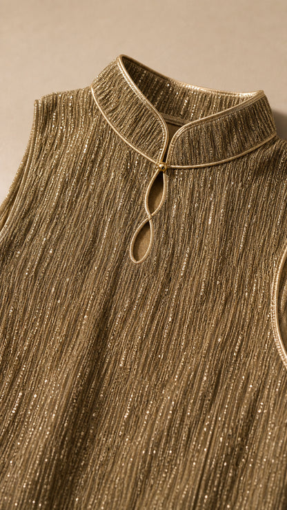 Close-up detail of the Mandarin collar and textured fabric in gold