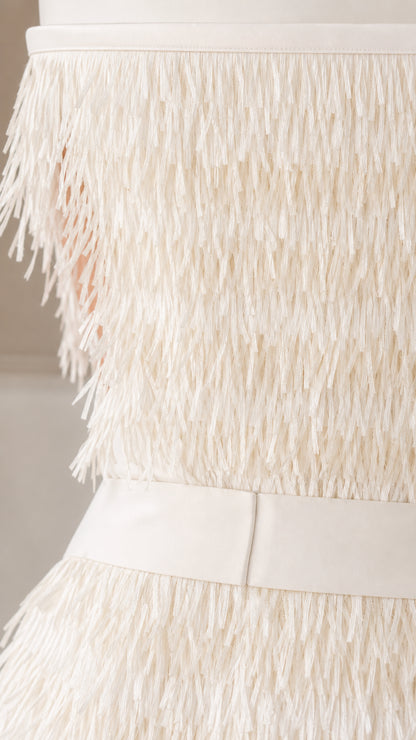 Close up of textured fringe detail and waistband