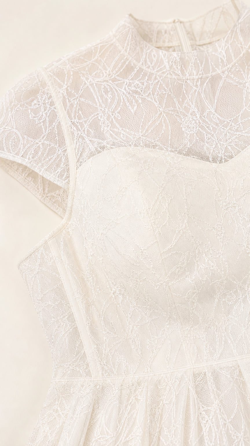 Close-up detail of sheer lace illusion neckline and sweetheart bodice