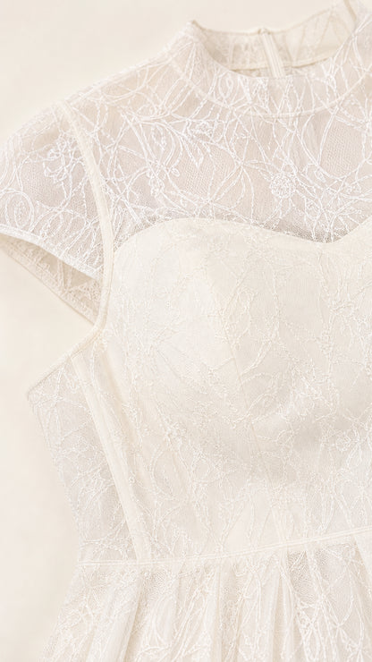 Close-up detail of sheer lace illusion neckline and sweetheart bodice