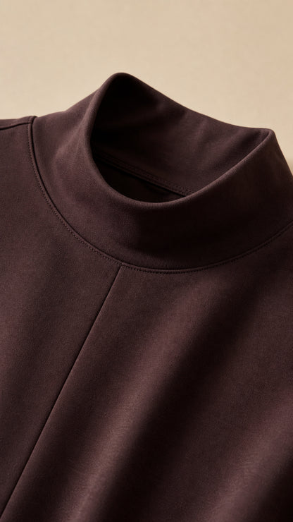 Close-up detail of mock neck collar and shoulder seaming