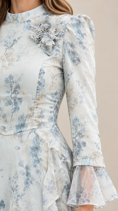 Close-up detail of mock neckline with 3D fabric flower and flared bell sleeve cuff