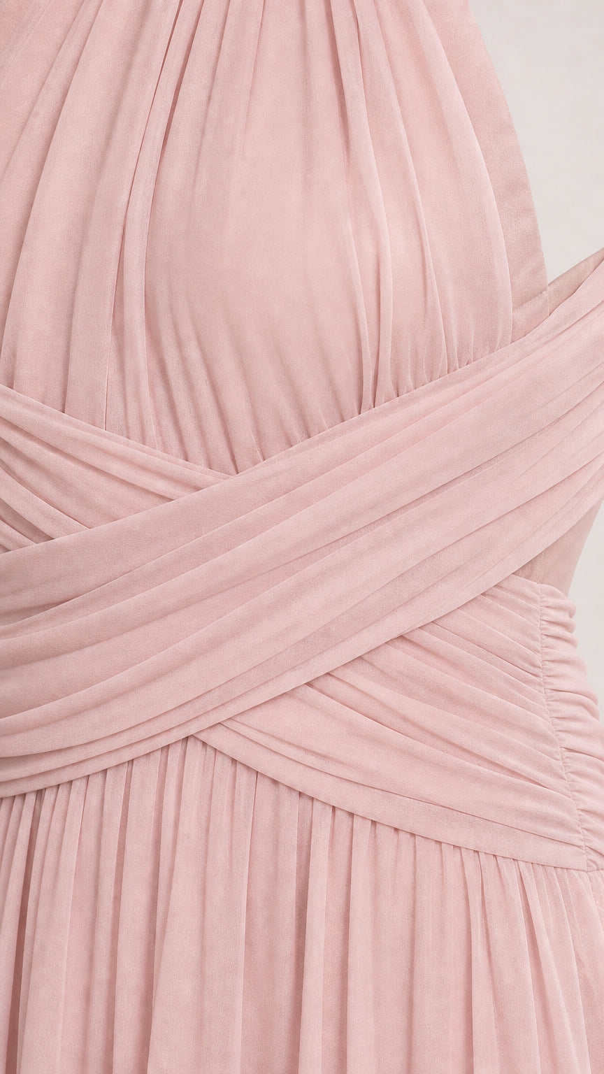 Close up of blush pink pleated criss-cross bodice and halter neckline