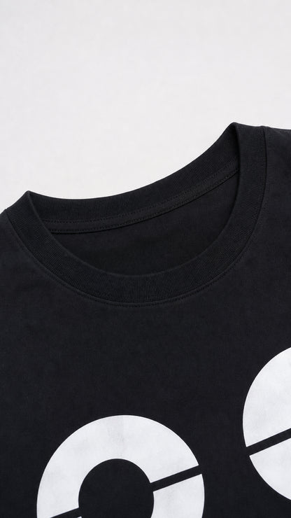 Close-up of crew neckline and '88' graphic print detail on black knit fabric