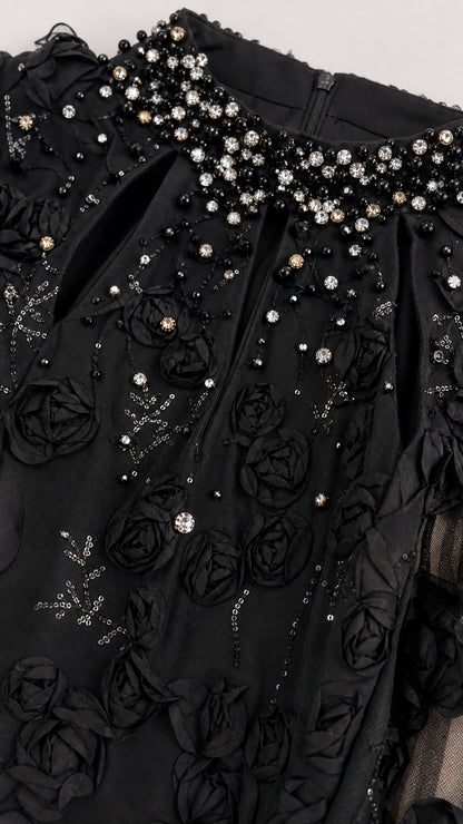 Close-up detail of black 3D floral lace bodice with crystal beading