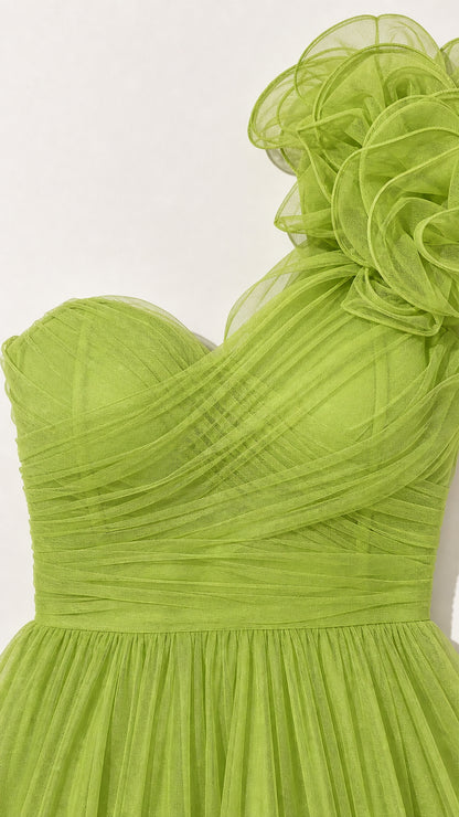 Close-up detail of bodice and shoulder rosette on green gown