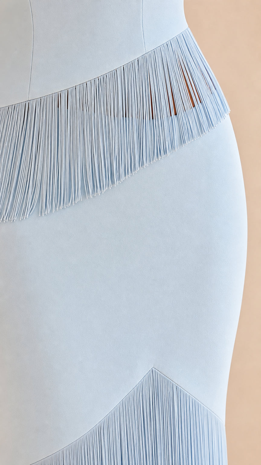 Close-Up Detail of Light Blue Cascading Fringe Accents on Maxi Dress