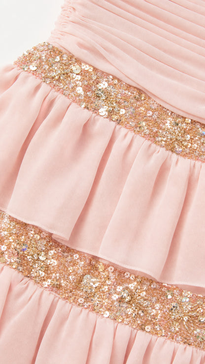 Close-up of sequin trim and chiffon ruffles