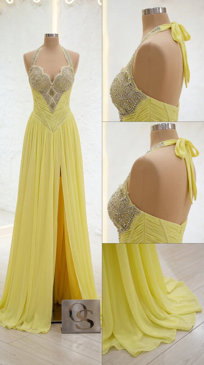 Mannequin detail of yellow embellished halter bodice and side slit