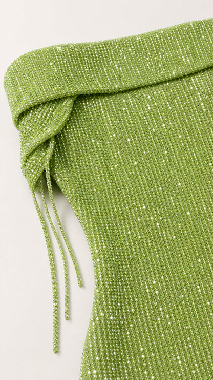 Close-up of green glittering foldover neckline and texture