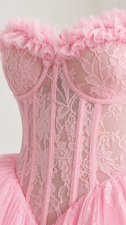 Close-up detail of structured lace corset bodice and ruffles