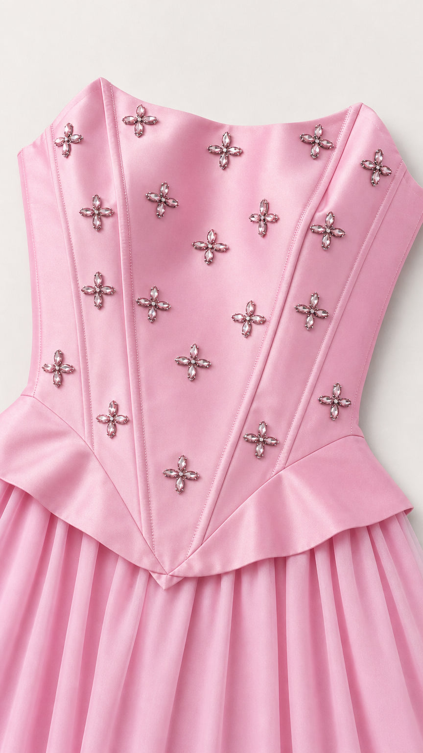 Close-up of crystal-embellished bodice and pleated waist