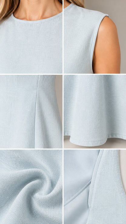Close-up details of Light Blue textured fabric neckline, hemline, and stitching