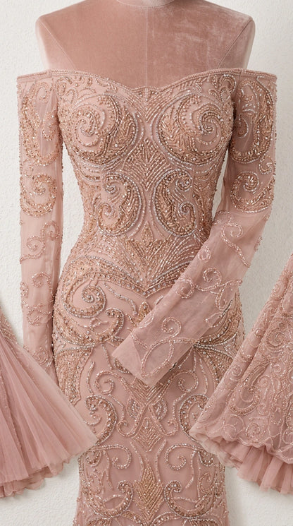 Close-up detail of intricate beading and mesh fabric on dusty rose evening dress
