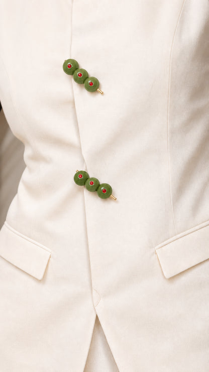 Close-up of olive-cluster buttons and front pocket detail
