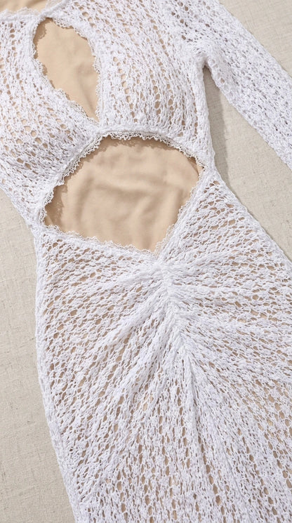 Close-up detail of front cutout and crochet texture on white dress