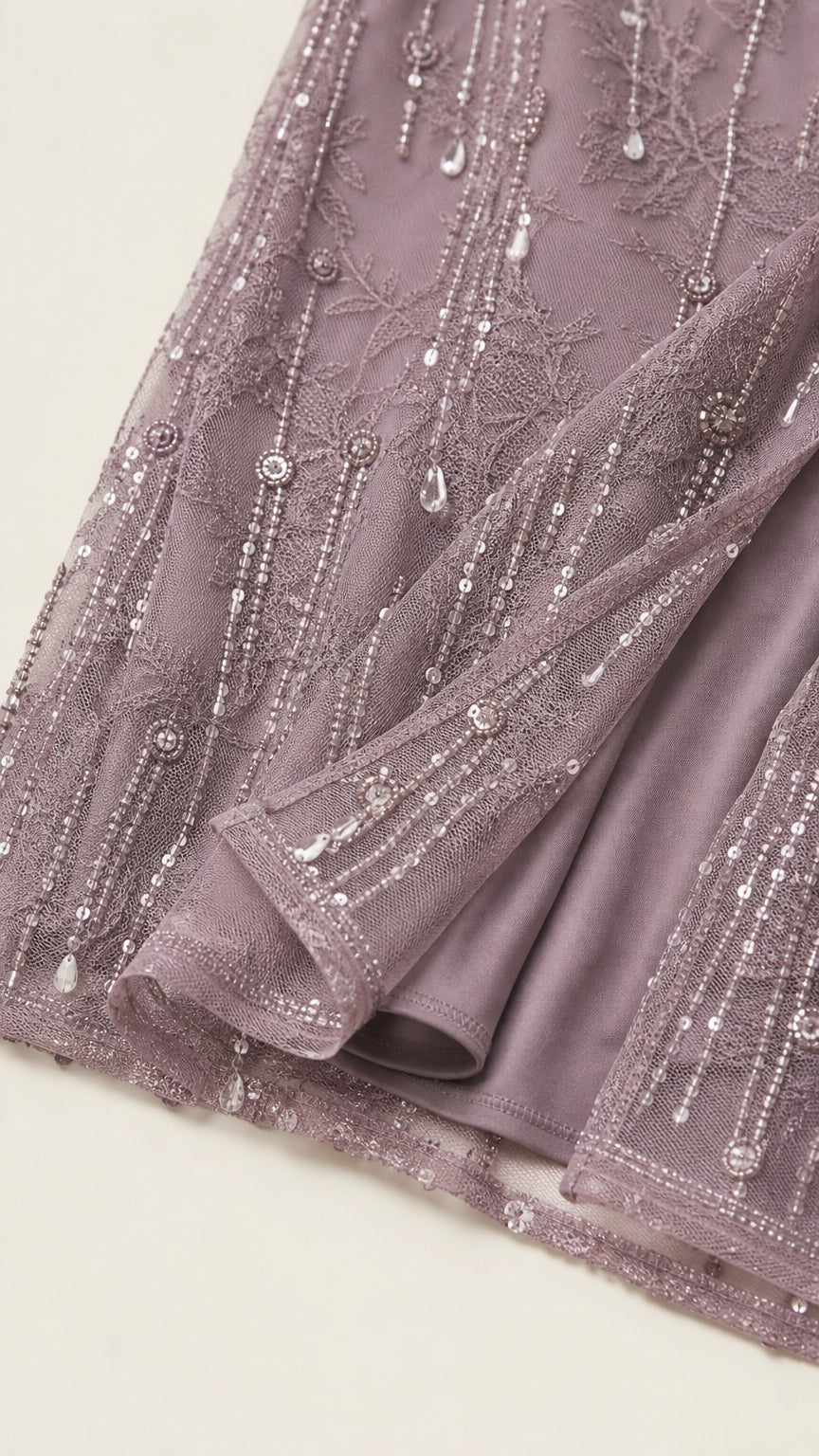 Close-up detail of sequin and bead embellishments on hem