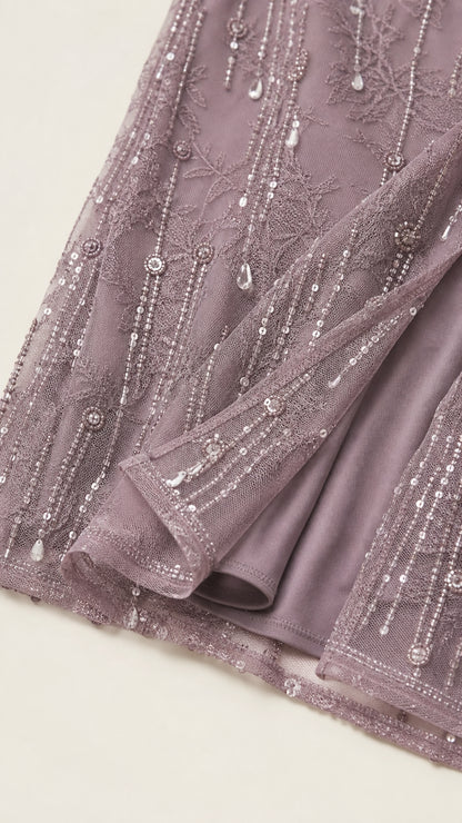 Close-up detail of sequin and bead embellishments on hem