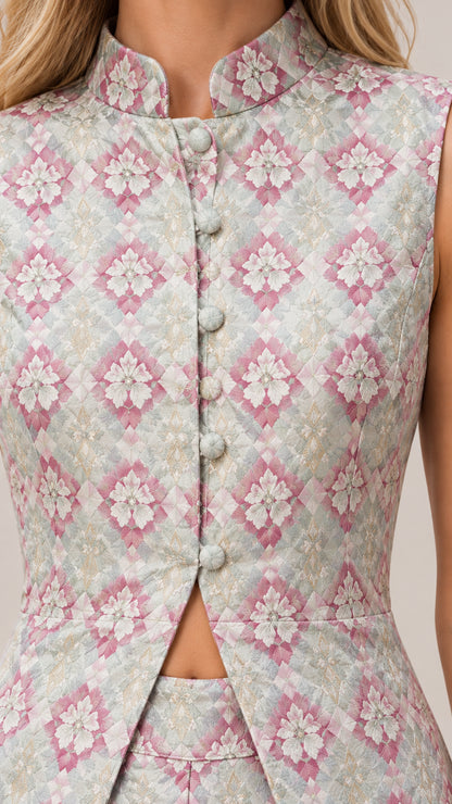 Close-up detail of mandarin collar, covered buttons, and intricate jacquard pattern