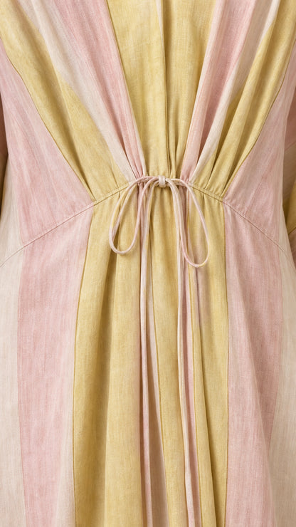Close-up of drawstring waist detail on striped kaftan dress