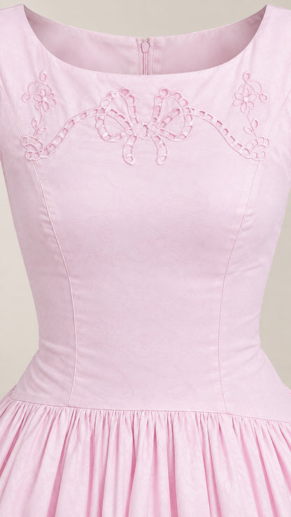 Close-up of Light Pink neckline showing detailed bow eyelet embroidery