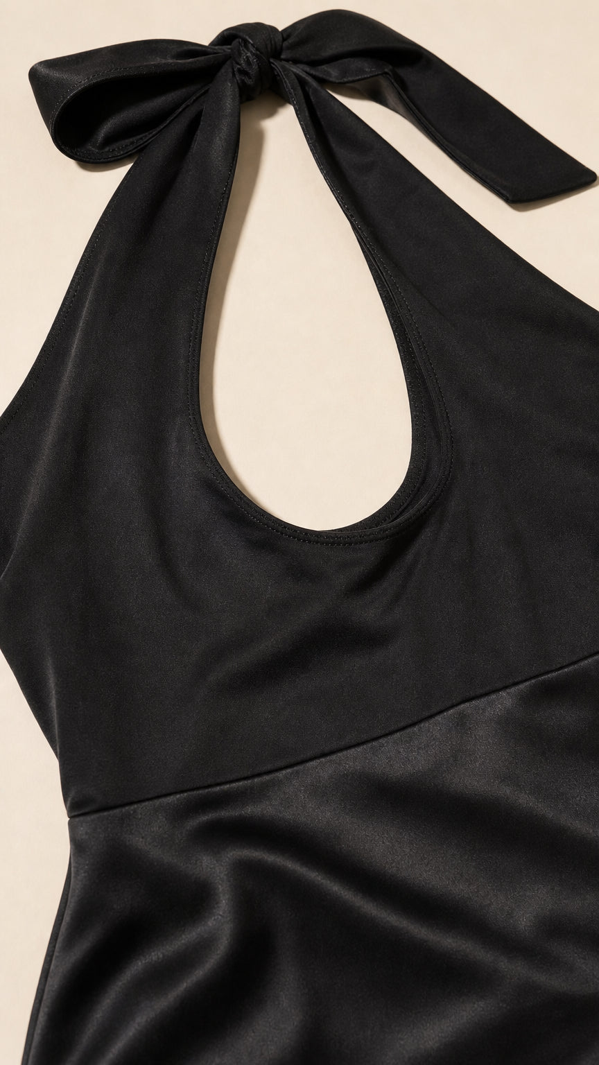 Close-up of the halter neckline and satin waistband detail