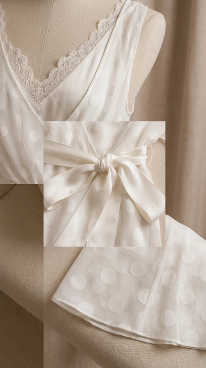 Close-up details of eyelash lace neckline, tied waist sash, and polka dot texture