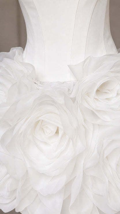 Close-up detail of 3d floral rosette skirt appliques