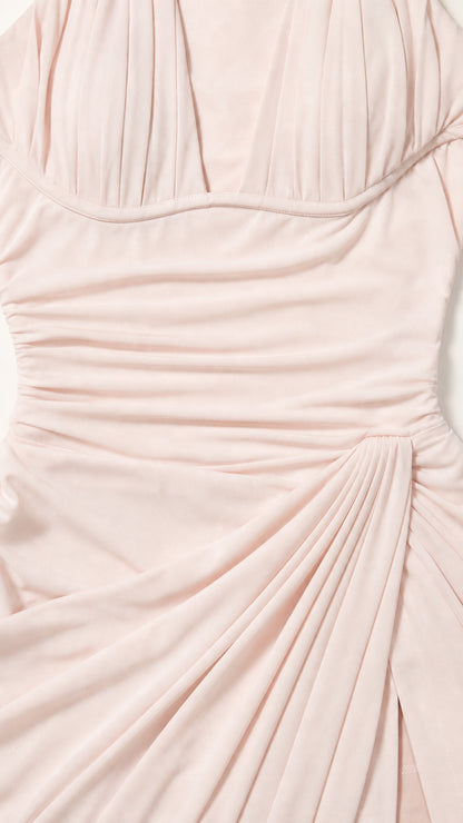Close-up detail of pleated bodice and ruched fabric texture