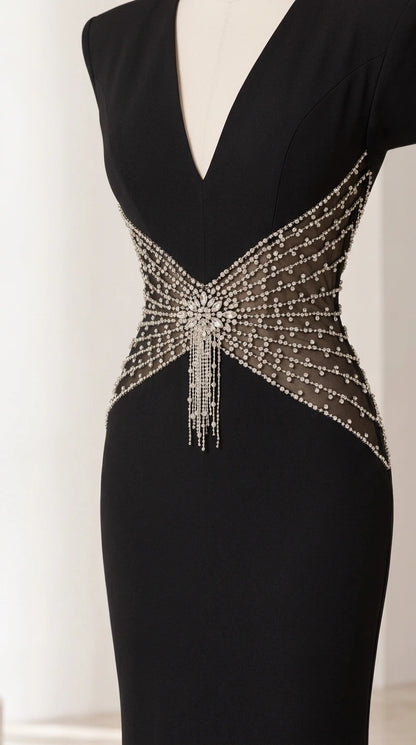 Close-up of deep V-neckline and intricate rhinestone waist embellishment with beaded fringe
