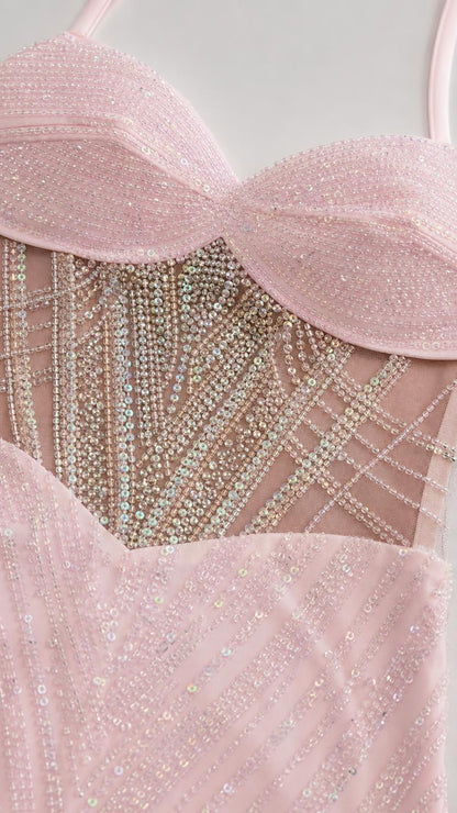 Close-up of sheer rhinestone embellished corset waist and sweetheart neckline