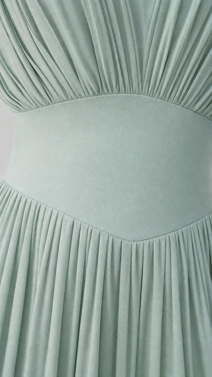 Close-up detail of bodice pleating and waist band on Sage Green dress