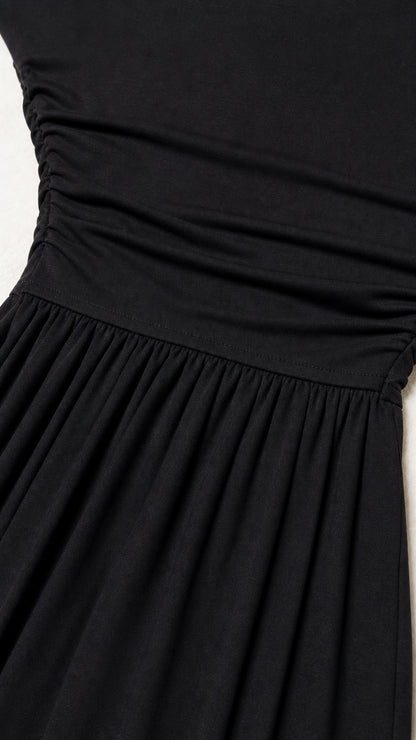Close up of black dress ruched bodice detail