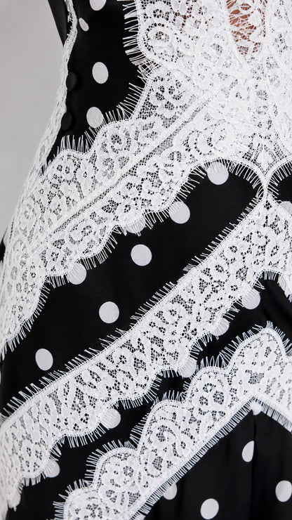 Close-up detail of white eyelash lace overlay and polka dot fabric