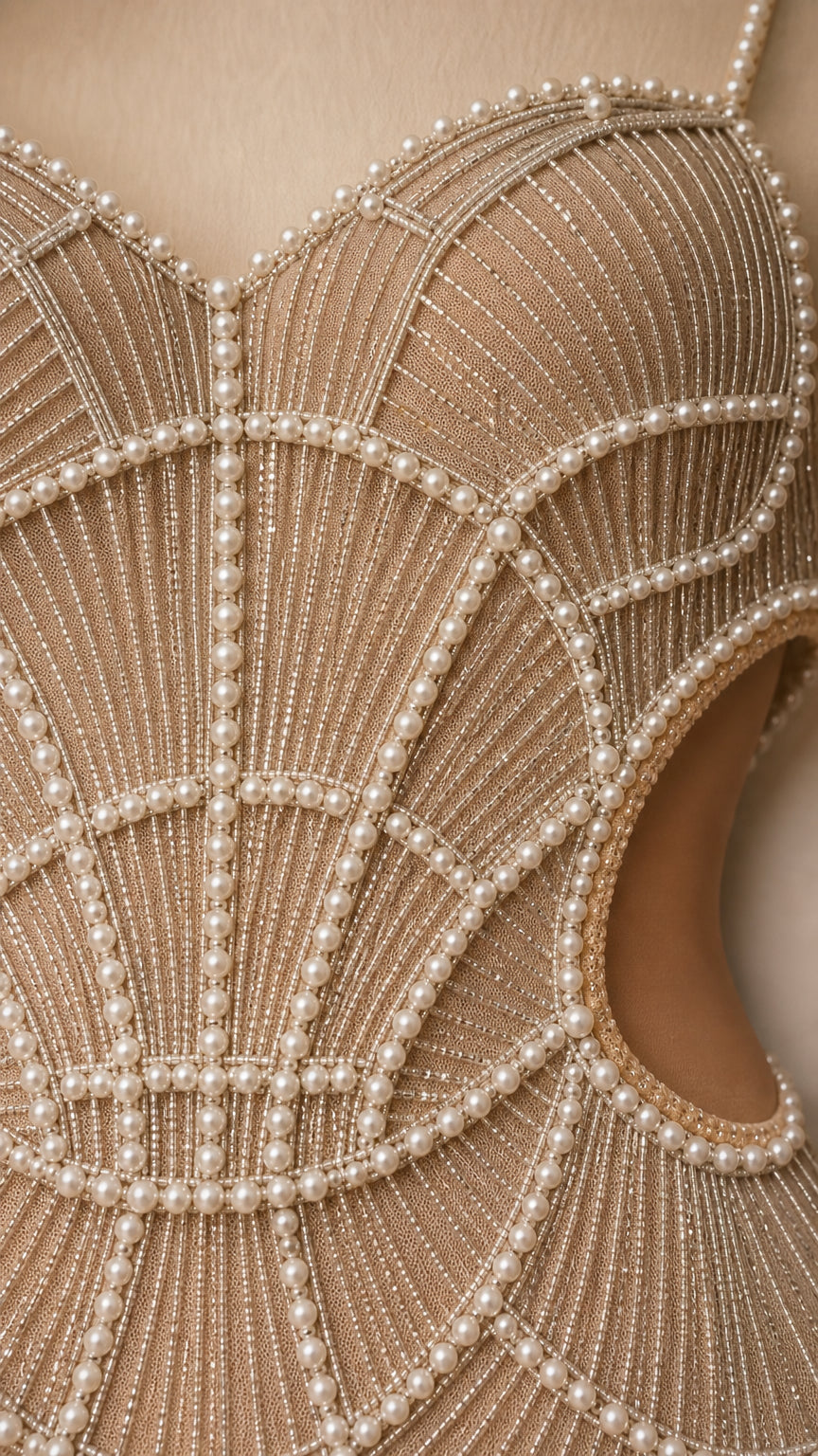 Close-up detail of sweetheart neckline with scalloped pearl and bead embroidery