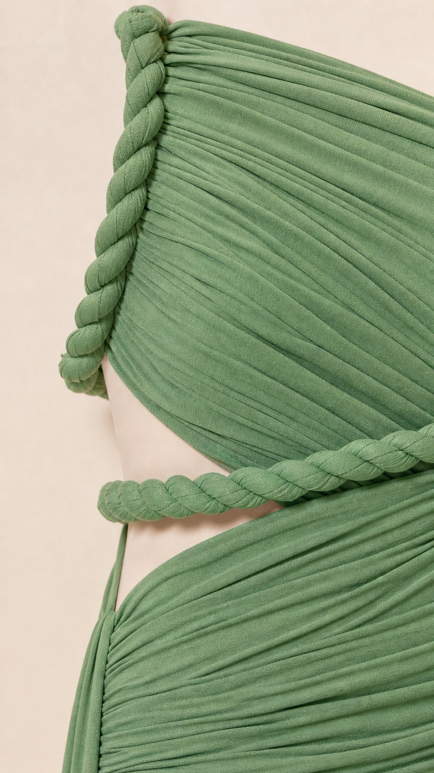 Close-up detail of Sage Green pleated jersey fabric and braided cord trim