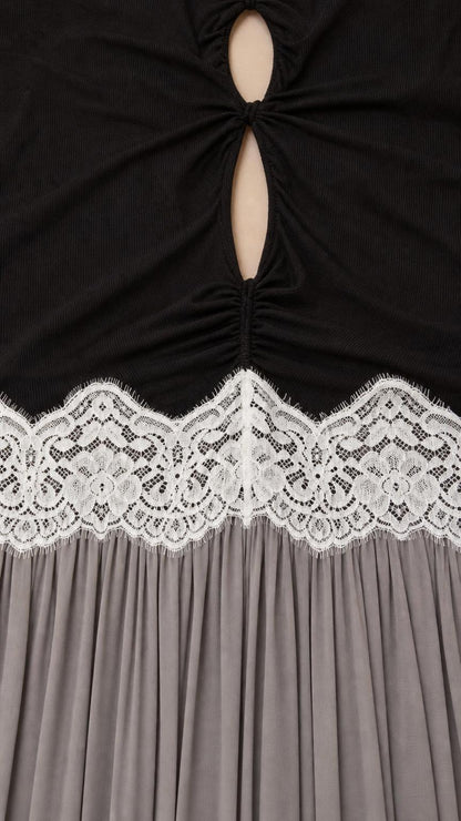 Close-up of bodice cutout and white lace waist trim