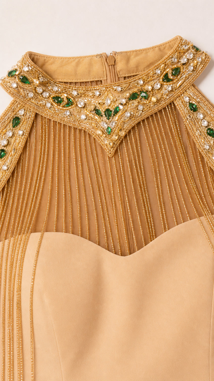 Close-up of jeweled halter neckline and beaded fringe details