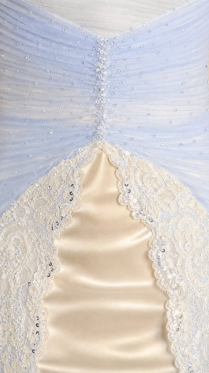 Close-up detail of ruched tulle bodice, beaded center accent, and scalloped lace trim
