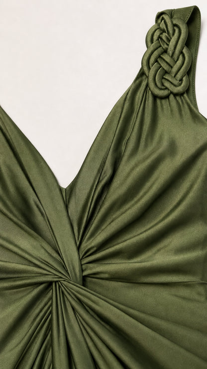 Close-up of braided strap and V-neckline on olive green dress