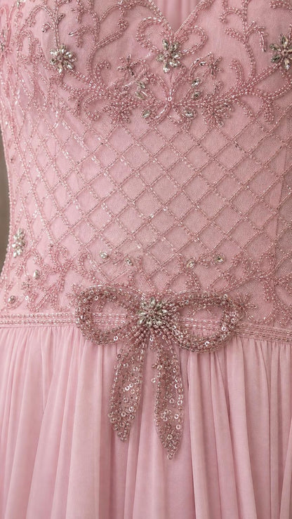 Close-up of beaded bodice and waist bow detail