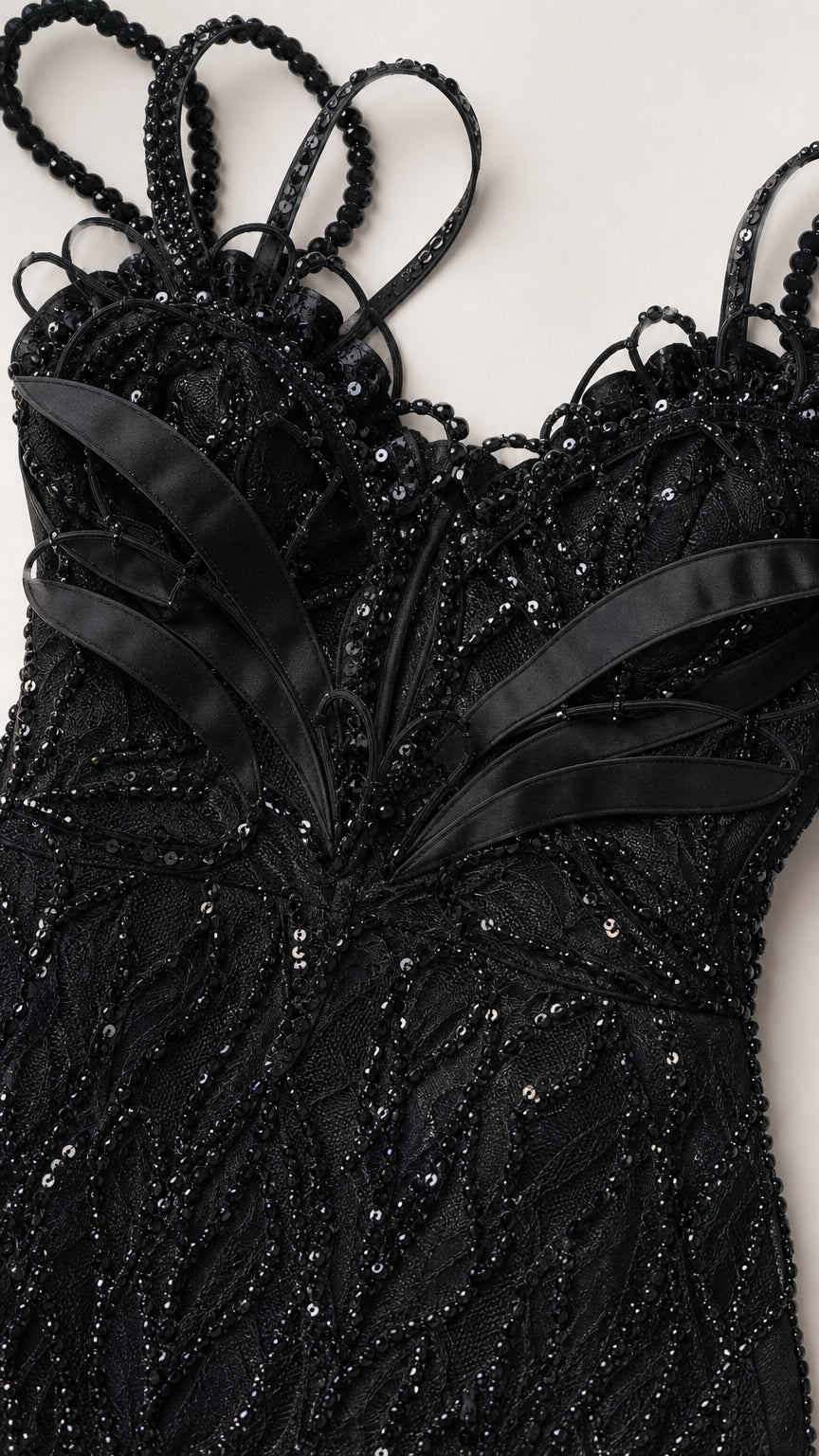 Close-up detail of beaded bodice, sweetheart neckline, and decorative straps